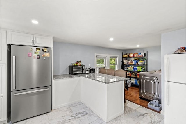 20 King St, Wilmington, MA 01887 - kitchen featuring freestanding refrigerator, light marble finish floors, a peninsula, and recessed lighting