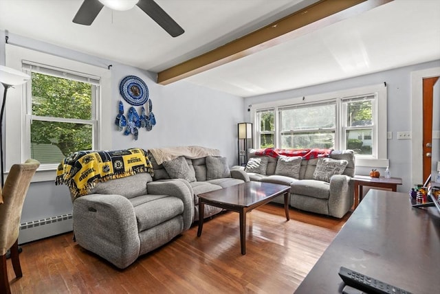 20 King St, Wilmington, MA 01887 - living area with plenty of natural light, a baseboard heating unit, ceiling fan, wood finished floors, and beamed ceiling