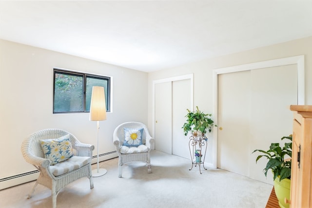 living area featuring a baseboard radiator and light carpet