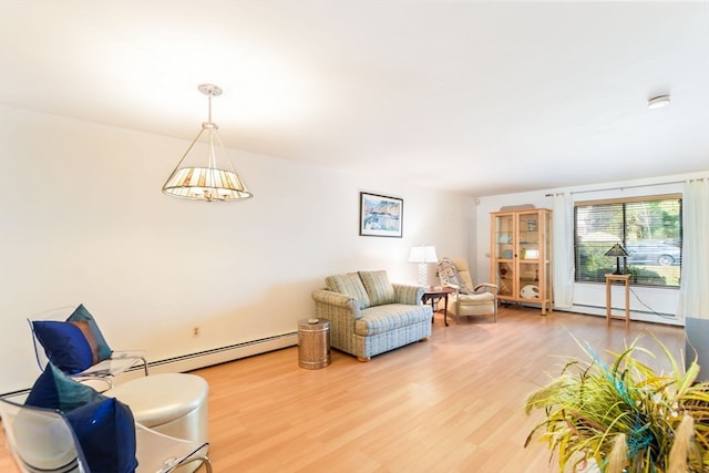 living room with a baseboard radiator and hardwood / wood-style floors