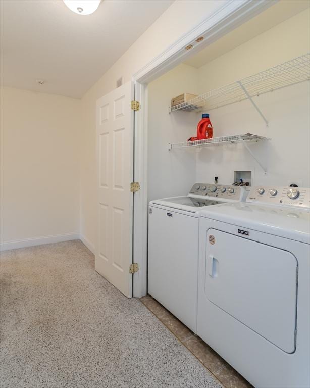 washroom featuring washer and dryer