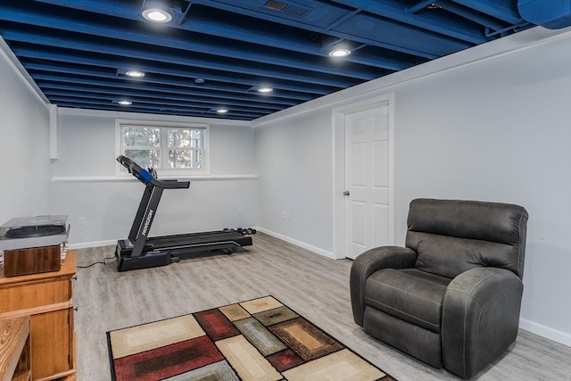 workout area featuring hardwood / wood-style flooring