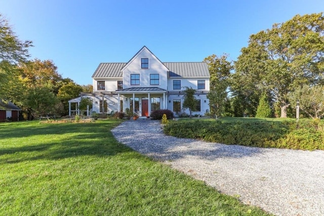 view of front of house with a porch and a front lawn