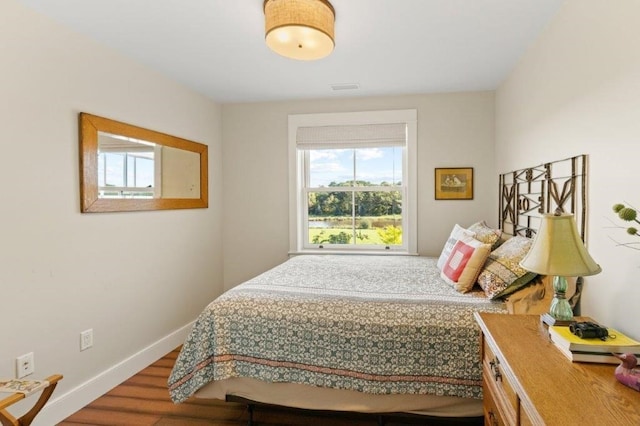 bedroom with hardwood / wood-style flooring