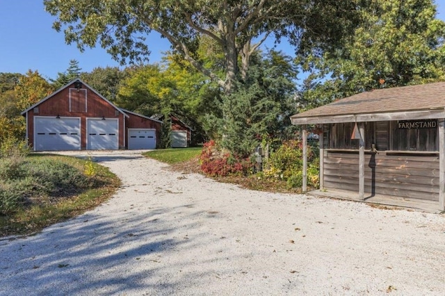 exterior space with an outbuilding and a garage