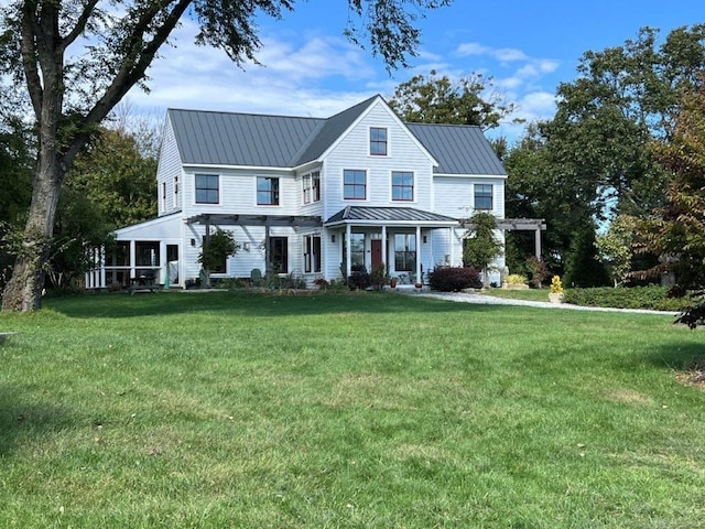 modern farmhouse style home with a front yard