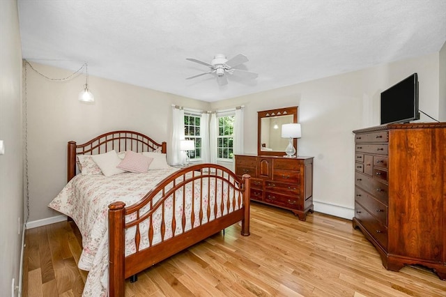 10 Shea Cir, Burlington, MA 01803 - bedroom featuring light wood finished floors, a baseboard heating unit, and a ceiling fan
