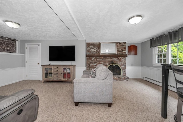 10 Shea Cir, Burlington, MA 01803 - carpeted living room featuring a textured ceiling, a wainscoted wall, and a brick fireplace