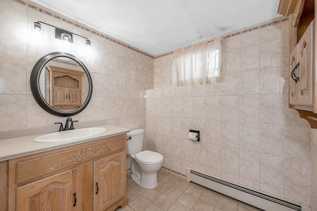 10 Shea Cir, Burlington, MA 01803 - bathroom with a baseboard radiator, tile walls, tile patterned floors, and vanity