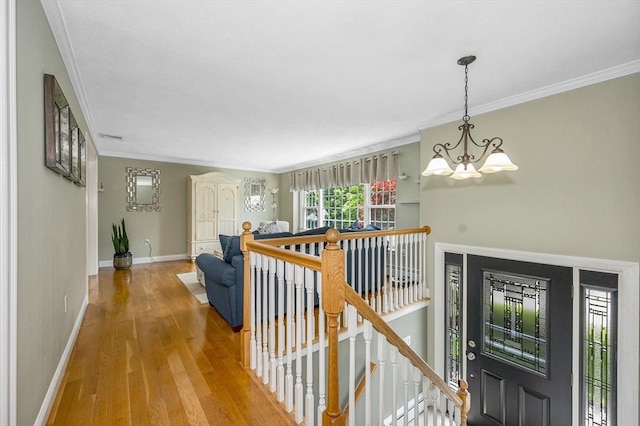 10 Shea Cir, Burlington, MA 01803 - hallway with an upstairs landing, a chandelier, wood finished floors, and crown molding