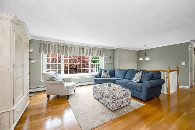 10 Shea Cir, Burlington, MA 01803 - living area with baseboard heating, a chandelier, ornamental molding, and wood finished floors