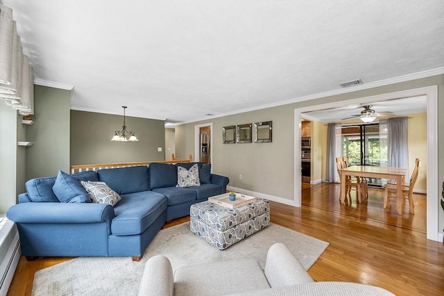 10 Shea Cir, Burlington, MA 01803 - living area with a chandelier, wood finished floors, crown molding, and a ceiling fan