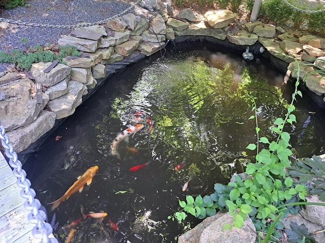 exterior details featuring a small pond