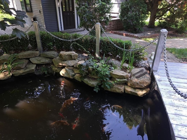 exterior details featuring a small pond