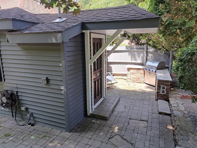 view of outdoor structure with an outdoor kitchen