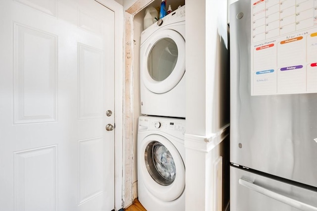 laundry area with stacked washer / dryer