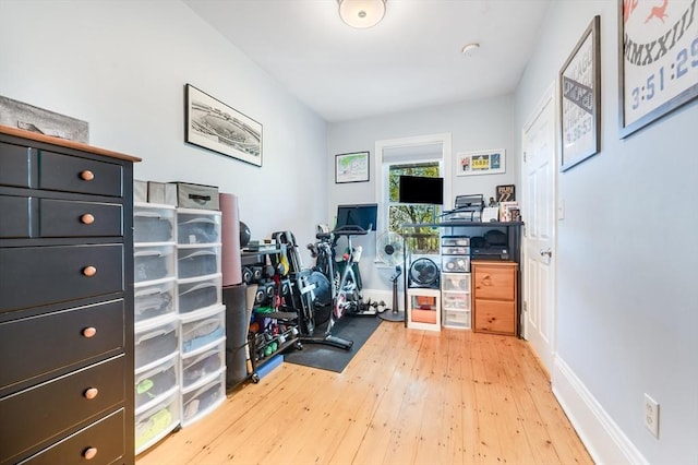 workout room with hardwood / wood-style floors