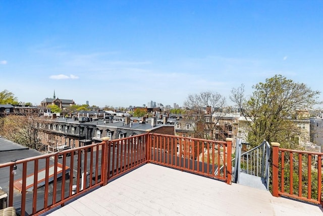 wooden terrace featuring a residential view