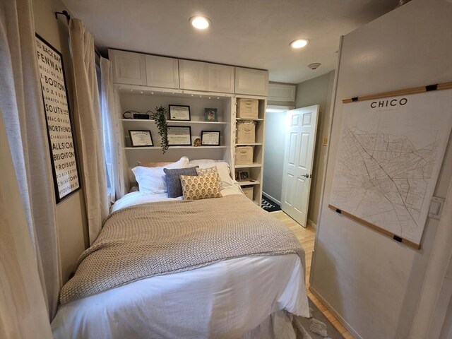 bedroom with light wood-type flooring and recessed lighting