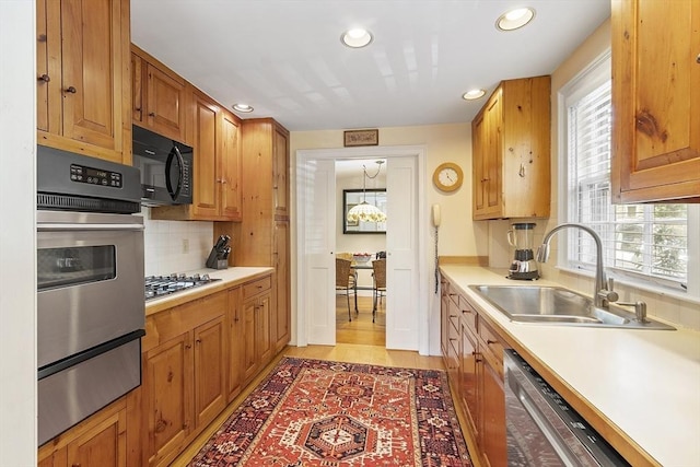20 Andrew St, Salem, MA 01970 - kitchen with recessed lighting, a wealth of natural light, a sink, a warming drawer, and stainless steel appliances