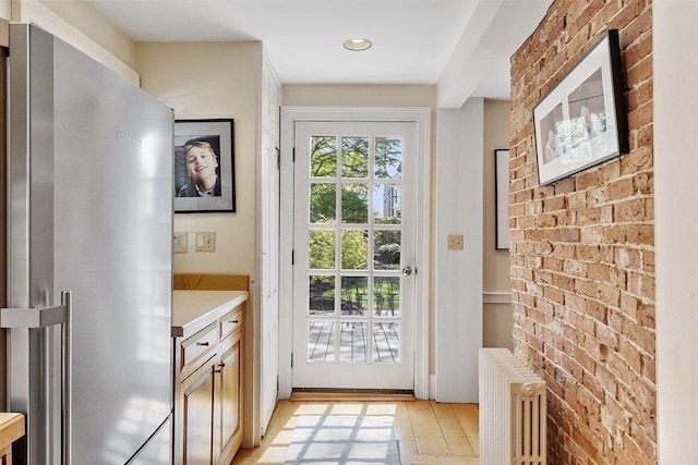 20 Andrew St, Salem, MA 01970 - doorway featuring recessed lighting, light wood-style flooring, and radiator heating unit