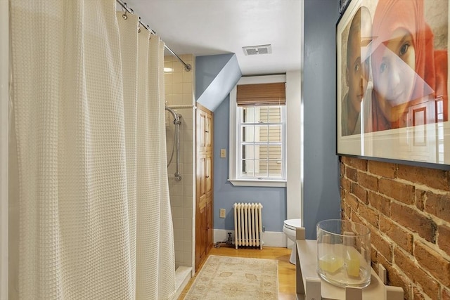 20 Andrew St, Salem, MA 01970 - bathroom with radiator, a shower with curtain, wood finished floors, visible vents, and baseboards