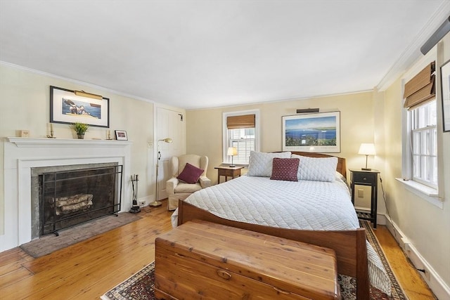 20 Andrew St, Salem, MA 01970 - bedroom with light wood finished floors, multiple windows, and ornamental molding