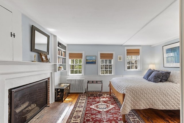 20 Andrew St, Salem, MA 01970 - bedroom featuring radiator, a fireplace, and hardwood / wood-style flooring