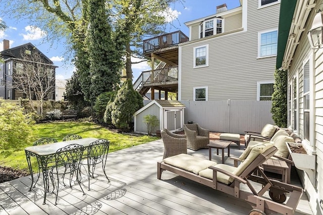 20 Andrew St, Salem, MA 01970 - wooden terrace featuring a storage unit, an outdoor living space, an outbuilding, a fenced backyard, and outdoor dining area