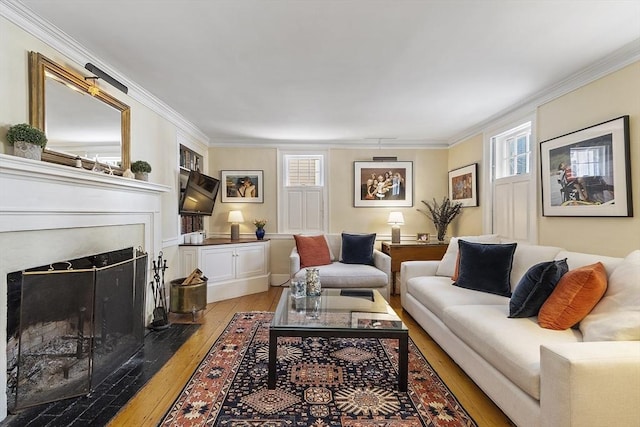 20 Andrew St, Salem, MA 01970 - living area featuring ornamental molding, light wood-style floors, and a fireplace with flush hearth