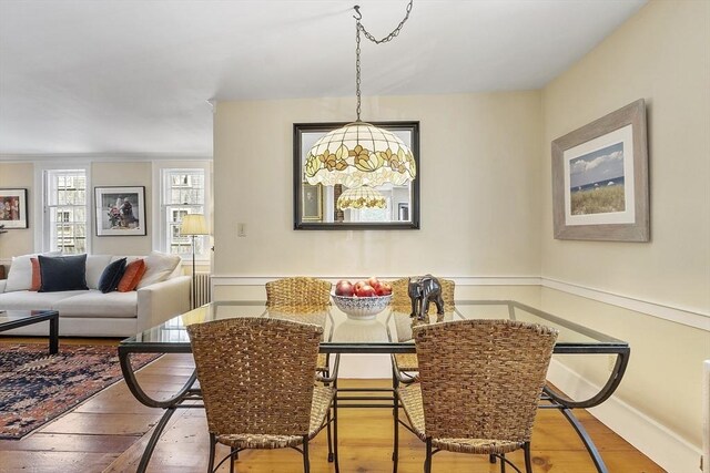 20 Andrew St, Salem, MA 01970 - dining area featuring hardwood / wood-style floors and an inviting chandelier