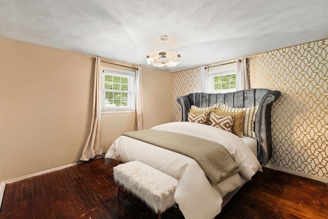 42 Mary Anne Ave, Brockton, MA 02302 - bedroom featuring wallpapered walls, wood-type flooring, a textured ceiling, and a chandelier