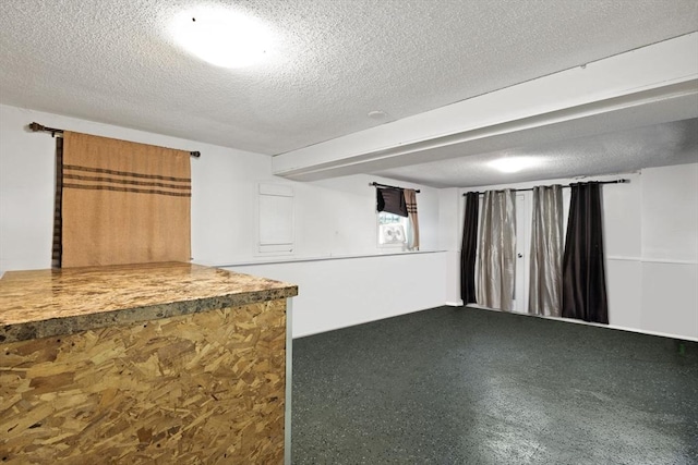 42 Mary Anne Ave, Brockton, MA 02302 - below grade area with a textured ceiling and carpet floors