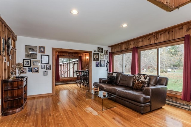 living room featuring a wealth of natural light and light hardwood / wood-style floors