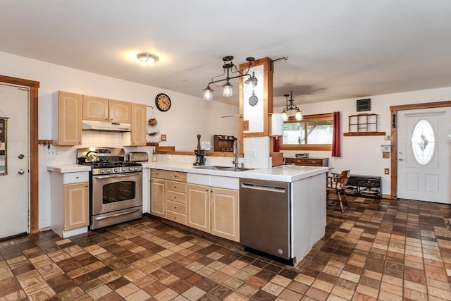 kitchen with appliances with stainless steel finishes, decorative light fixtures, backsplash, kitchen peninsula, and light brown cabinets