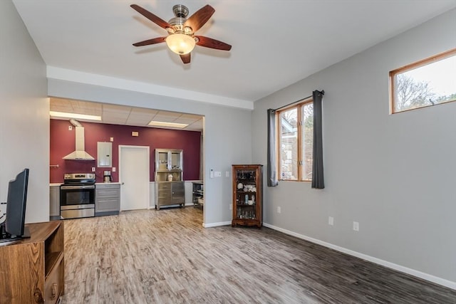 living room featuring hardwood / wood-style flooring and ceiling fan