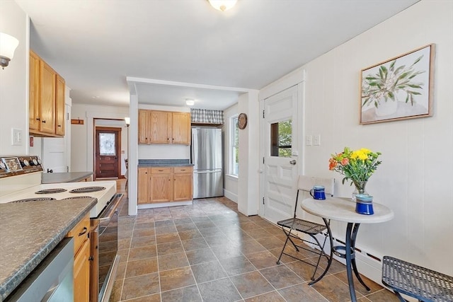 49 Maple St, Oakham, MA 01068 - kitchen with appliances with stainless steel finishes, healthy amount of natural light, and dark countertops