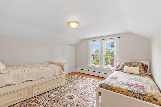 49 Maple St, Oakham, MA 01068 - bedroom with baseboard heating, vaulted ceiling, and light wood-type flooring