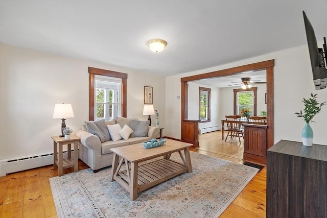 49 Maple St, Oakham, MA 01068 - living area with a baseboard radiator, healthy amount of natural light, and light wood finished floors