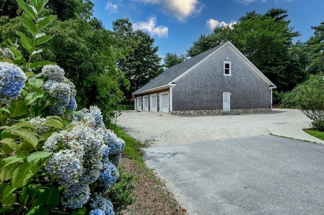 view of side of property featuring a garage