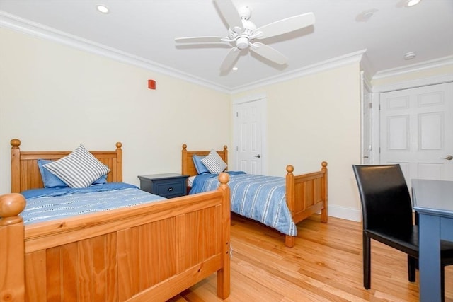 bedroom featuring recessed lighting, crown molding, and wood finished floors