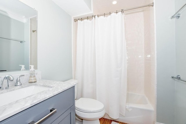 full bathroom with toilet, shower / bathtub combination with curtain, and vanity