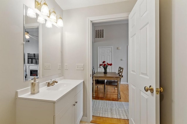 46 Ashford Unit 14, Methuen, MA 01844 - bathroom featuring vanity, a ceiling fan, and wood finished floors
