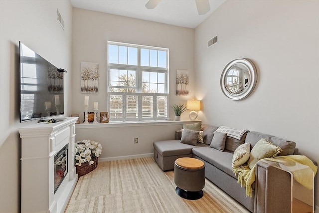46 Ashford Unit 14, Methuen, MA 01844 - carpeted living area with a glass covered fireplace and a ceiling fan