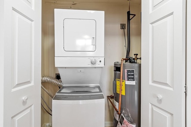 46 Ashford Unit 14, Methuen, MA 01844 - washroom with electric water heater and estacked washer and dryer