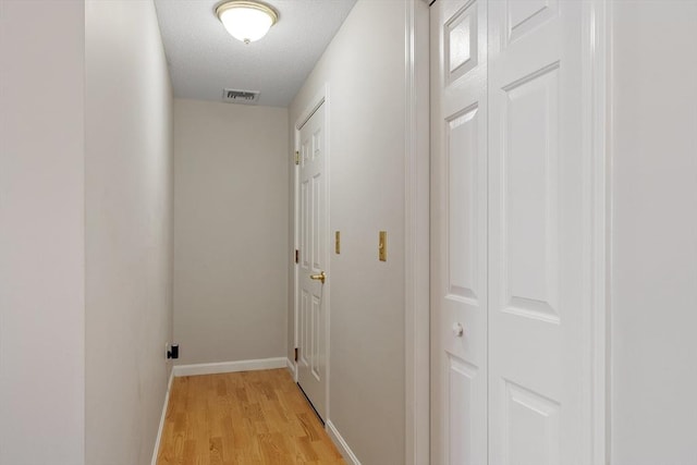 46 Ashford Unit 14, Methuen, MA 01844 - hallway featuring light wood-style floors and a textured ceiling