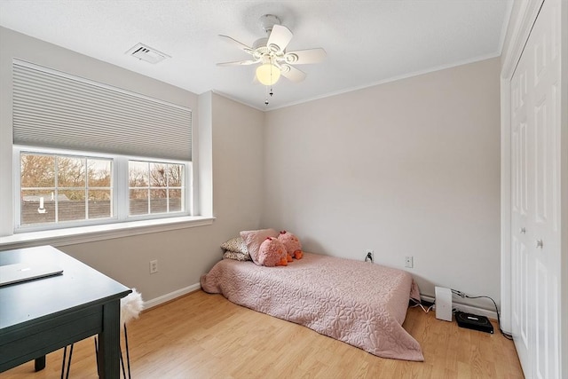 46 Ashford Unit 14, Methuen, MA 01844 - bedroom with a closet, wood finished floors, crown molding, and a ceiling fan
