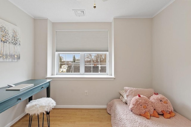 46 Ashford Unit 14, Methuen, MA 01844 - bedroom with wood finished floors, ornamental molding, and a desk