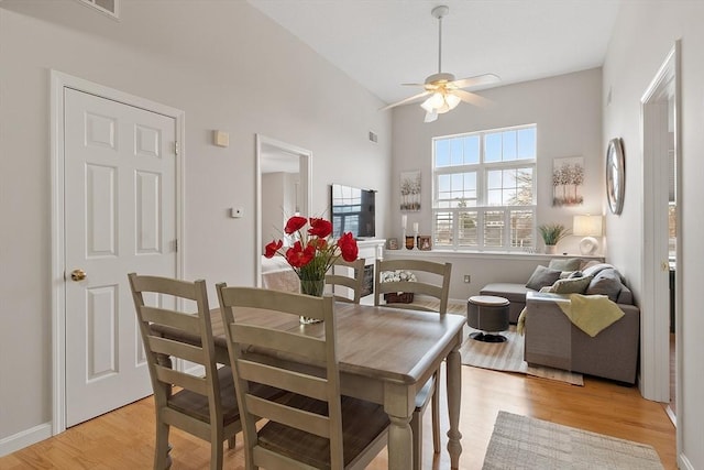 46 Ashford Unit 14, Methuen, MA 01844 - dining area with a ceiling fan, light wood-style floors, and a high ceiling