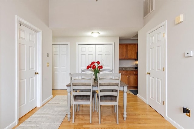 46 Ashford Unit 14, Methuen, MA 01844 - dining room with light wood-style flooring and baseboards